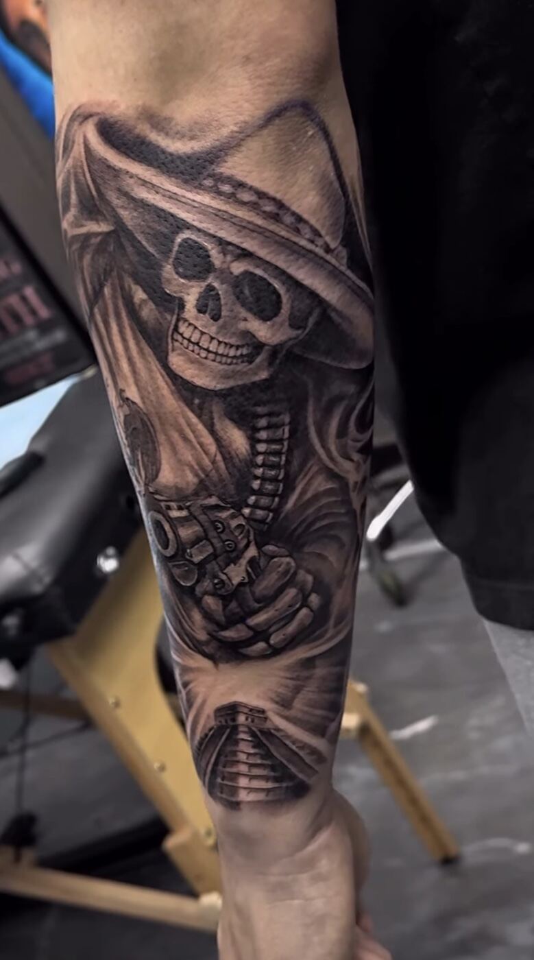 Black and grey realism forearm sleeve, skeleton vaquero with revolver