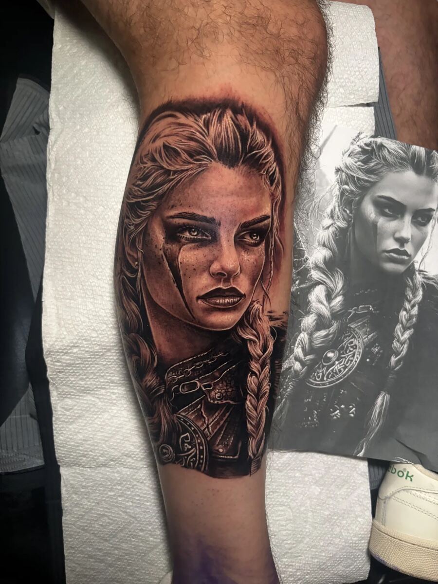 Black and grey realism calf, female warrior portrait with braided hair
