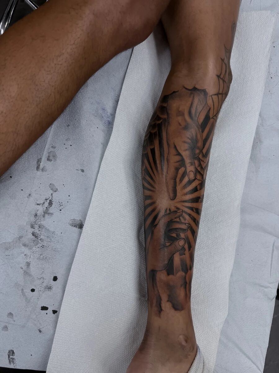 Black and grey illustrative shin, palm leaf and abstract sun rays